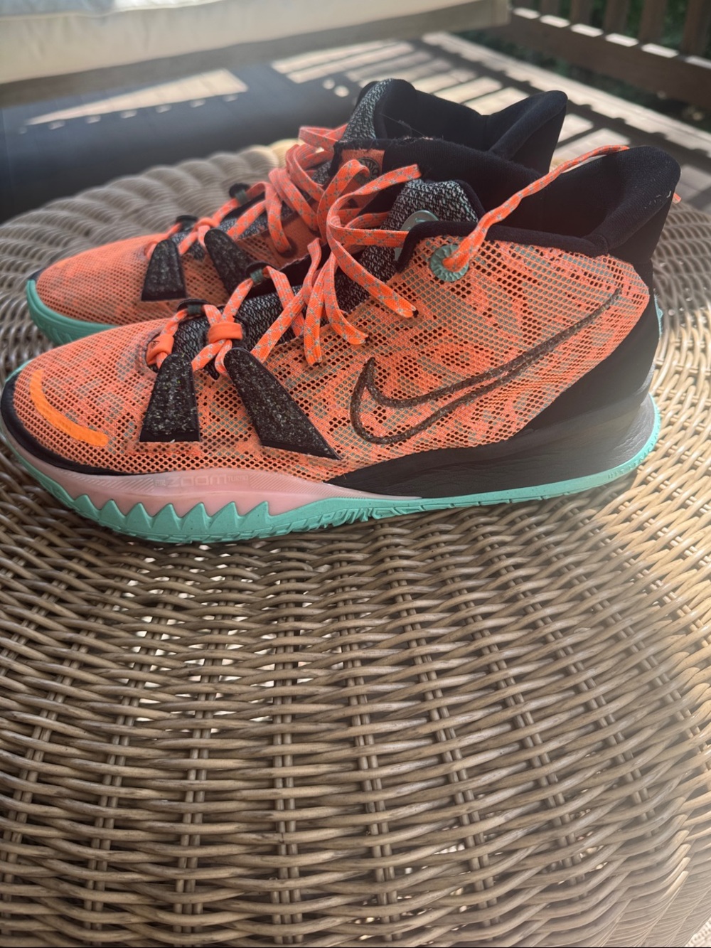 Nike Kyrie Irving basketball shoes .  Bright Orange and Mint High-Top Sneakers